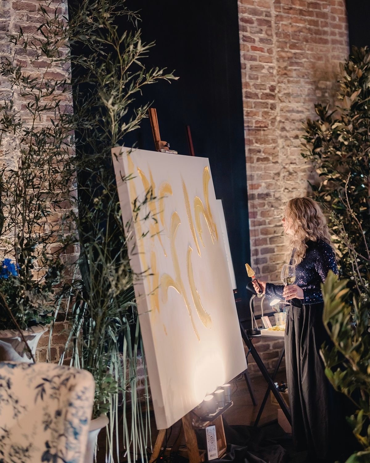 A live painter working by candlelight during a Reflection Night